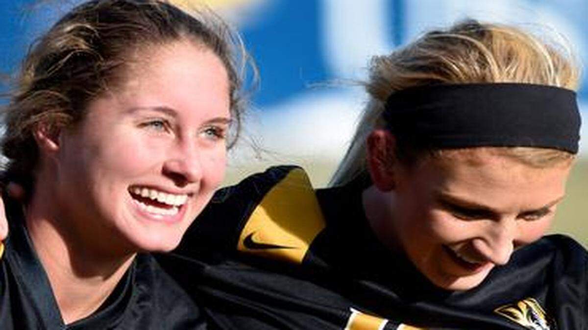
Missouri teammates Lauren Selaiden (left) and Melanie Donaldson celebrated their 3-1 over Kansas in an NCAA women’s soccer tournament match Sunday at Rock Chalk Park in Lawrence.
