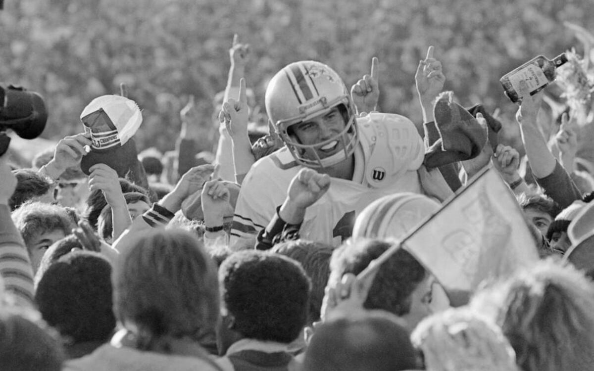 In this 1979 file photo, Ohio State University quarterback Art Schlichter got a victory ride by teammates and fans in Ann Arbor, Mich., after an 18-15 win over Michigan.