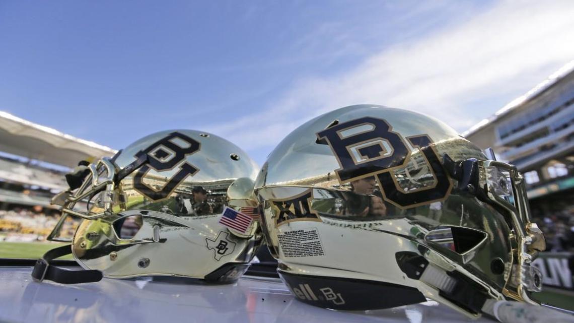 In this Dec. 5, 2015, file photo, Baylor helmets on shown the field after an NCAA college football game in Waco, Texas.