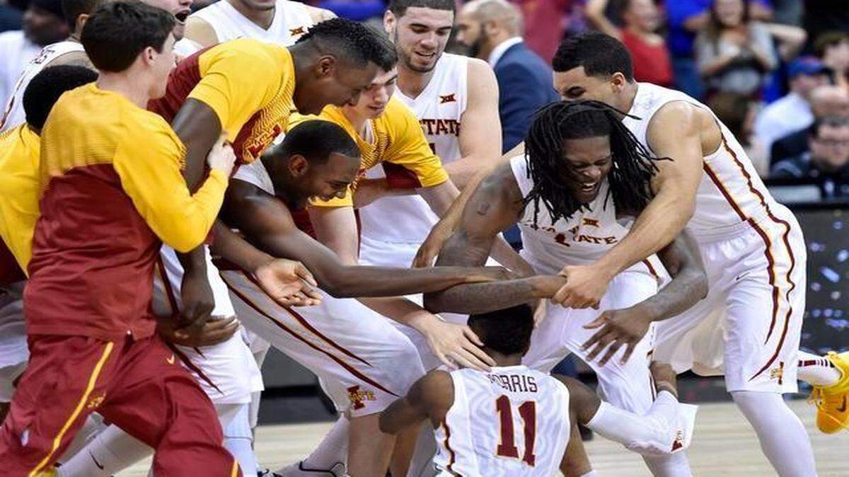 
After hitting the winning shot for Iowa State against Texas, the Cyclones’ Monte’ Morris (11) was mobbed by his teammates. ISU came from behind to beat the Longhorns, 69-67, in the Big 12 Tournament quarterfinals Thursday at the Sprint Center.
