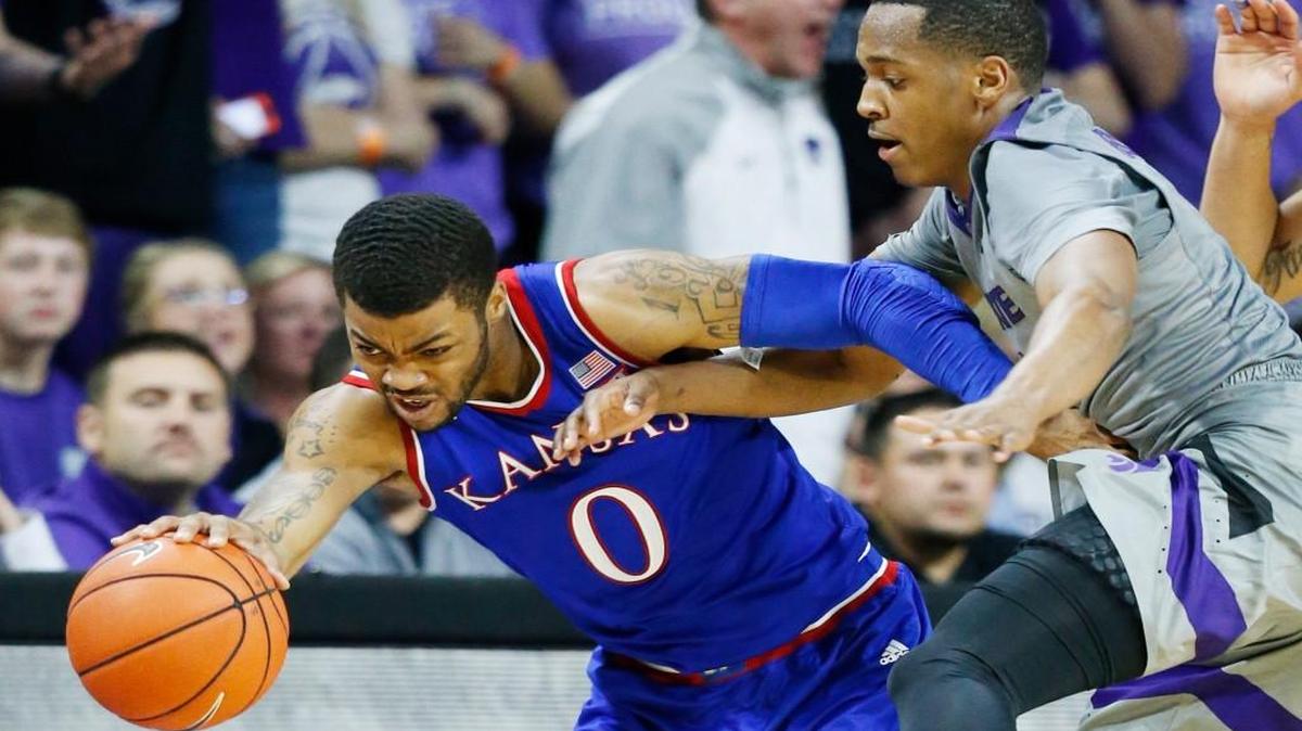 Kansas guard Frank Mason III and K-State guard Barry Brown battle for a rebound Saturday as K-State and Kansas battled in Bramlage Coliseum(February 20, 2016)