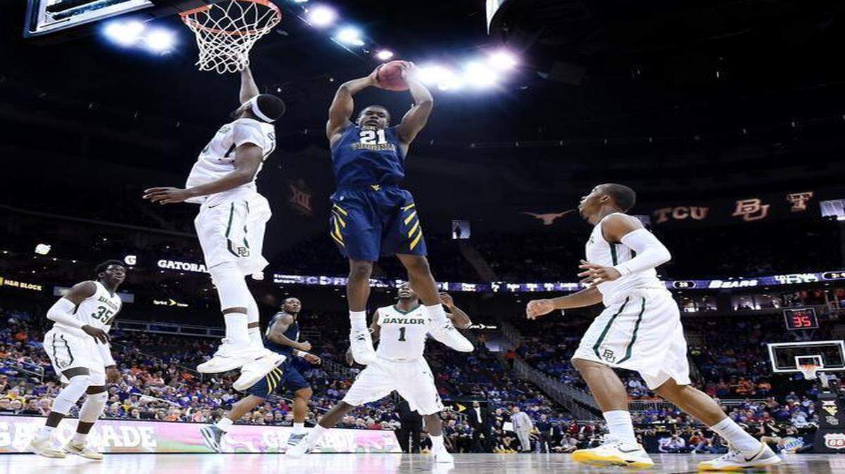 
West Virginia’s BillyDee Williams snagged a rebound during the first half of their game against Baylor on Thursday afternoon at the Big 12 Tournament.
