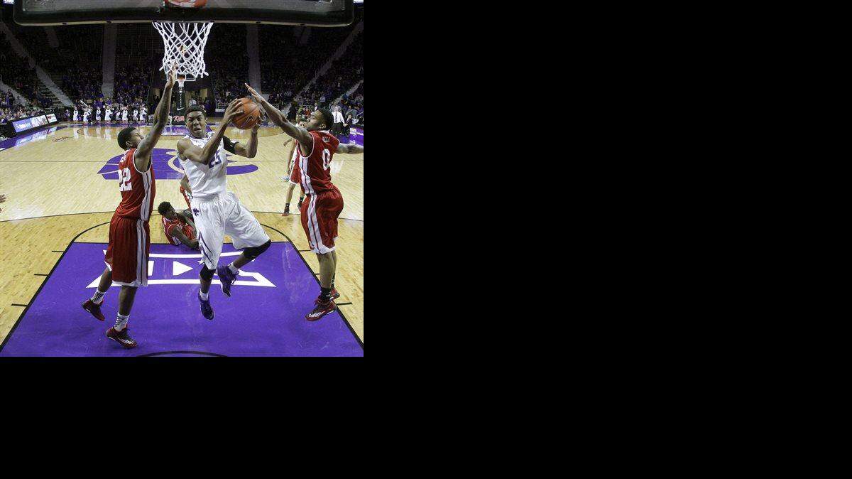 
Kansas State's Wesley Iwundu (25) gets between Bradley's Xzavier Taylor (22) and Ka'Darryl Bell (0) to shoot during the second half of an NCAA college basketball game Tuesday, Dec. 9, 2014, in Manhattan, Kan. Kansas State won 50-47. (AP Photo/Charlie Riedel)
