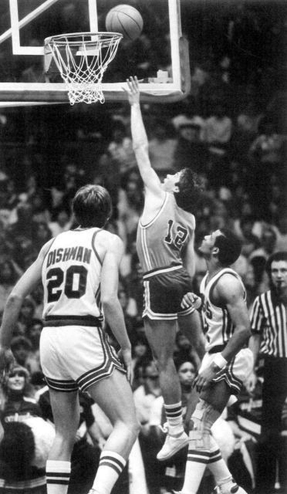 FILE: Kansas State guard Tim Jankovich scores over Jeff Dishman and Tyke Peacock in 1982.