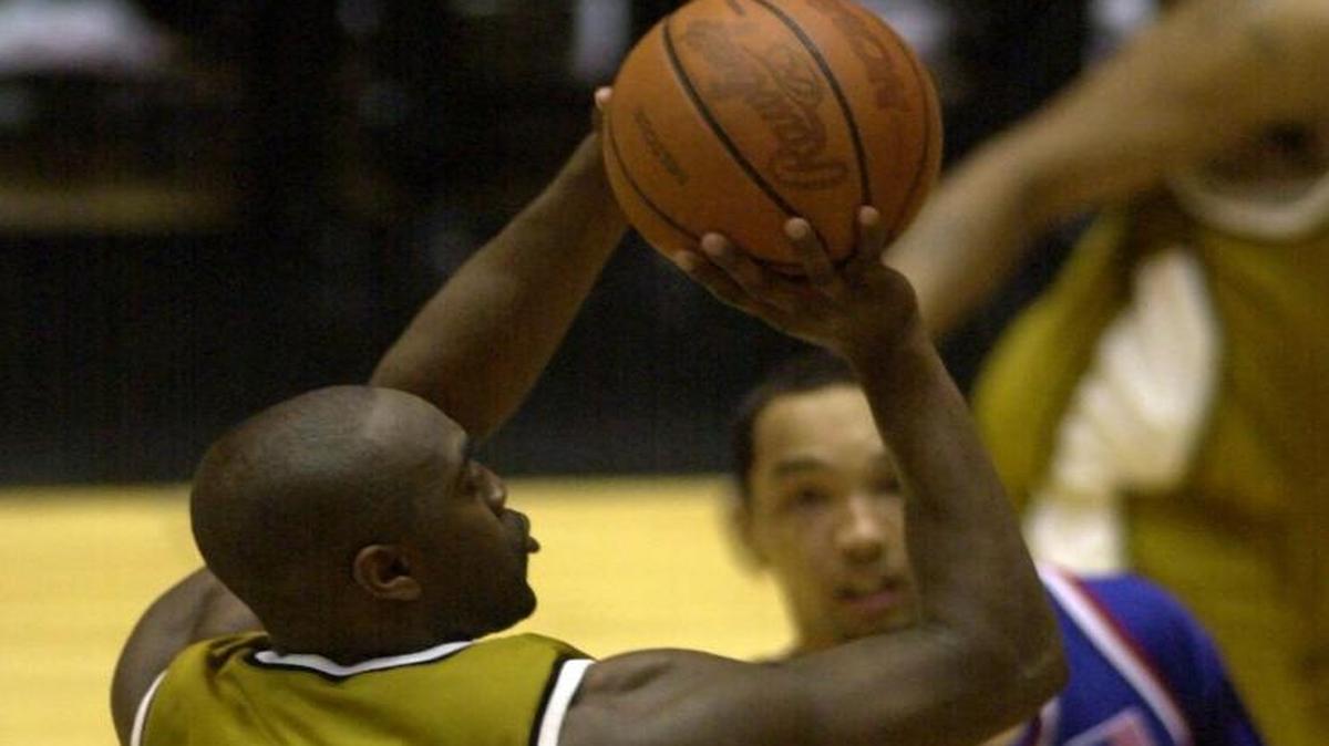 Missouri’s Clarence Gilbert took a shot as Kansas’ Drew Gooden watched during a game in 2002.