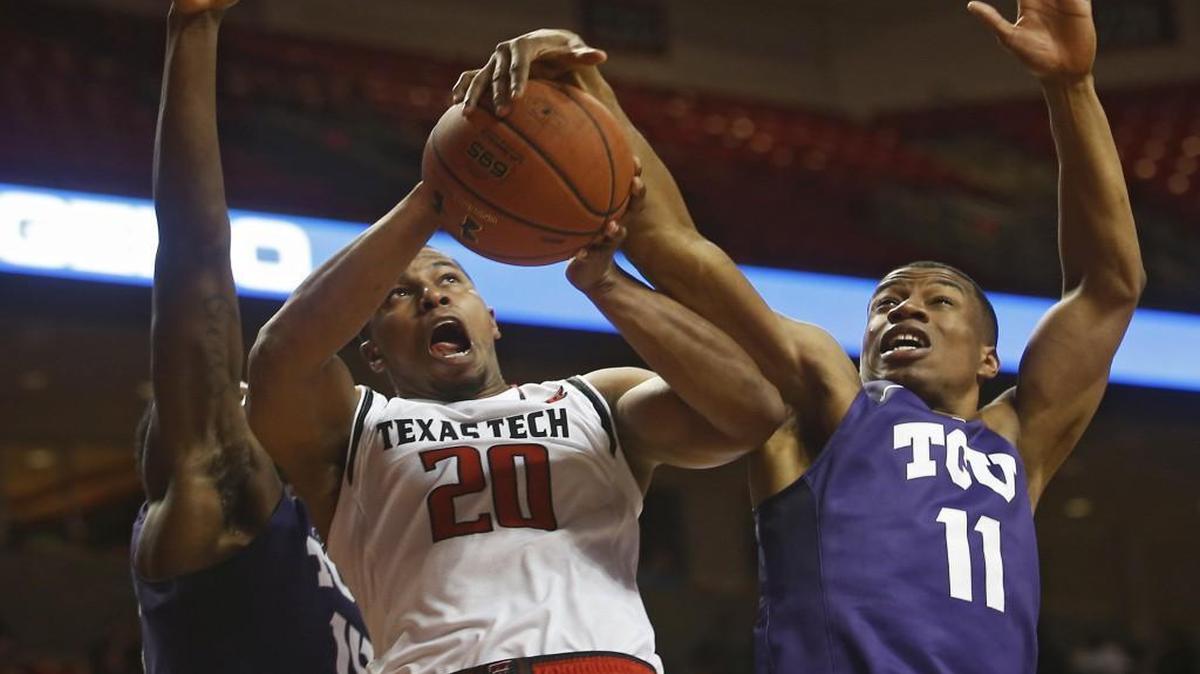TCU’s Brandon Parrish (right) blocked a shot by Texas Tech’s Toddrick Gotcher during a game in February.
