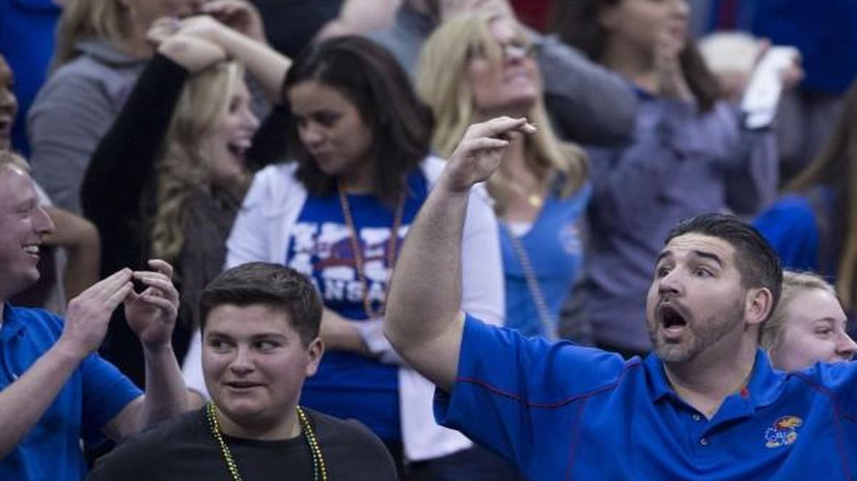 Kansas fans reacted after Kansas Jayhawks guard Wayne Selden Jr. dunked in the second half during KU’s win over Baylor at the Big 12 Tournament on Friday night.