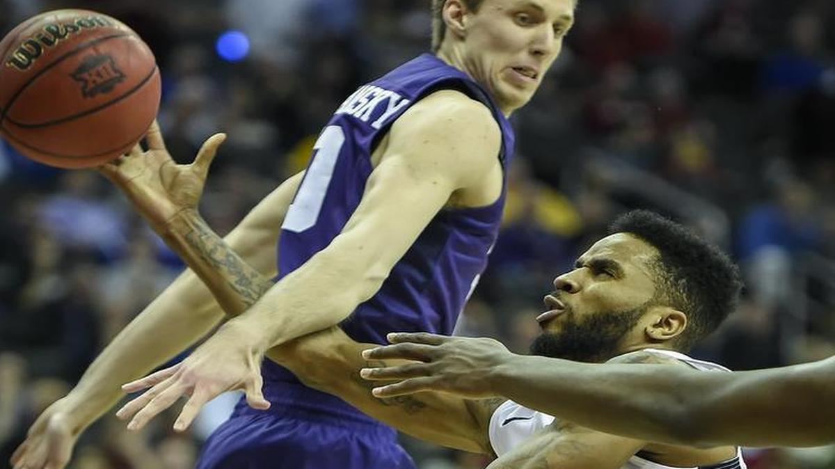 West Virginia guard Tarik Phillip (right) drove to the basket and was fouled by TCU forward Vladimir Brodziansky in the second half Thursday. West Virginia won, 86-66.
