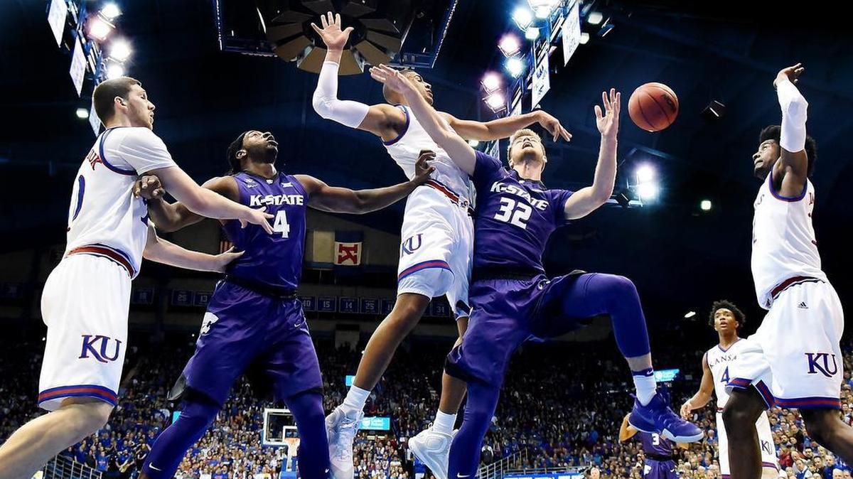 KU’s Landen Lucas swatted away a shot by K-State’s Dean Wade during the first half of last year’s game at Allen Fieldhouse. KU beat K-State, 90-88.