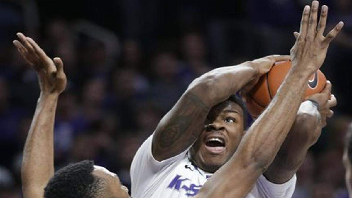 
Kansas State guard Marcus Foster, back, is defended by TCU guard Trey Zeigler (32) during the second half of an NCAA college basketball game in Manhattan, Kan., Wednesday, Jan. 7, 2015. Kansas State defeated TCU 58-53. (AP Photo/Orlin Wagner)
