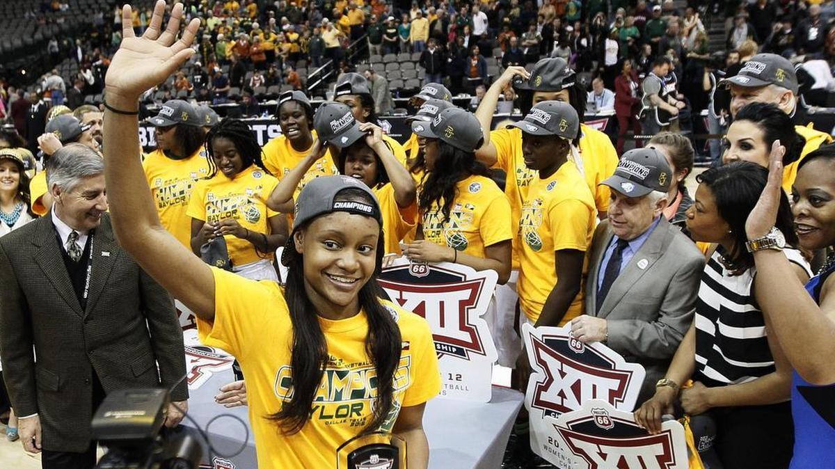 Baylor forward Nina Davis waves to fans after accepting the Most Outstanding Player award after the Bears won the 2015 Big 12 women’s basketball tournament in Dallas. Baylor beat Texas 75-64.