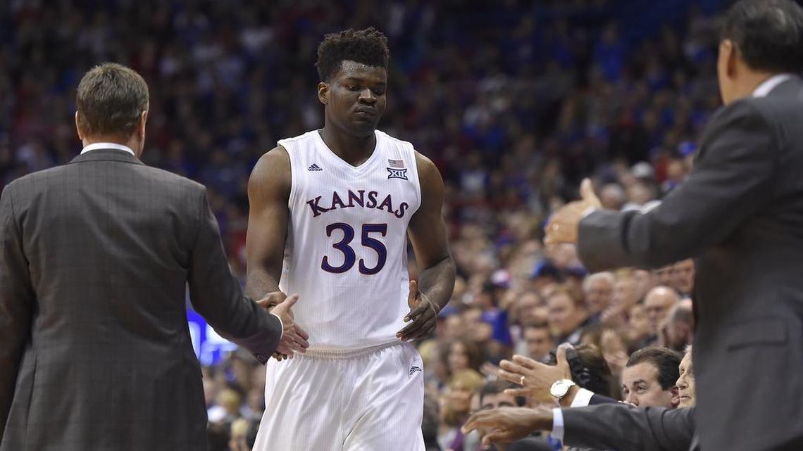 After getting his first start and scoring 17 points, KU's Udoka Azubuike (35) got hand shakes all around from the Jayhawk coaching staff after leaving the game late in the second half of Friday night's game at Allen Fieldhouse. KU beat UNC-Asheville, 95-57.