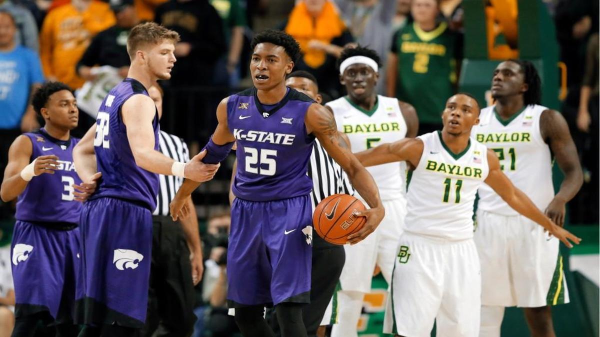 Kansas State’s Dean Wade (left) reached out to Wesley Iwundu (25), who walked away from Baylor’s Johnathan Motley (5), Lester Medford (11) and Taurean Prince (21) in the second half as the Wildcats and Bears played Wednesday night in Waco, Texas. No. 13 Baylor won the game 79-72 in double overtime.