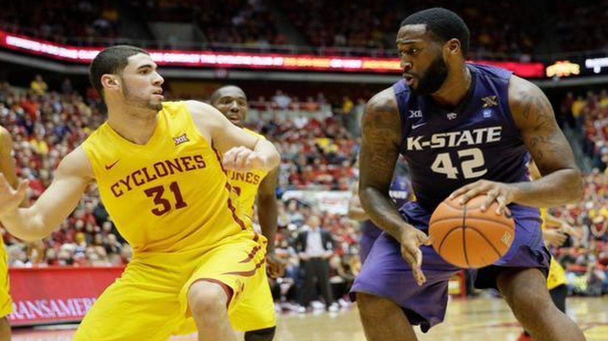 
Kansas State forward Thomas Gipson looked to drive around Iowa State forward Georges Niang during the second half of their Jan. 20 game in Ames that the Cyclones won 77-71.
