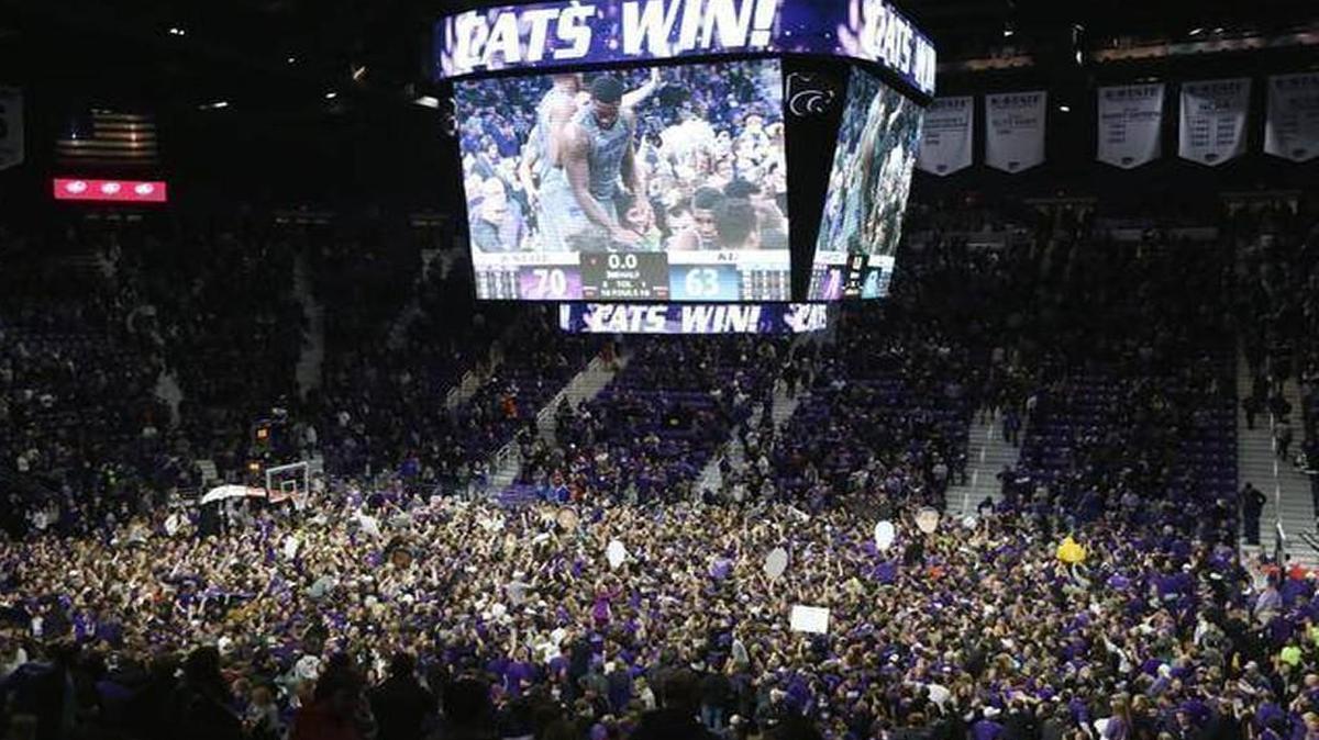 K-State fans storm the court following a 70-63 victory against Kansas at Bramlage Coliseum last February.