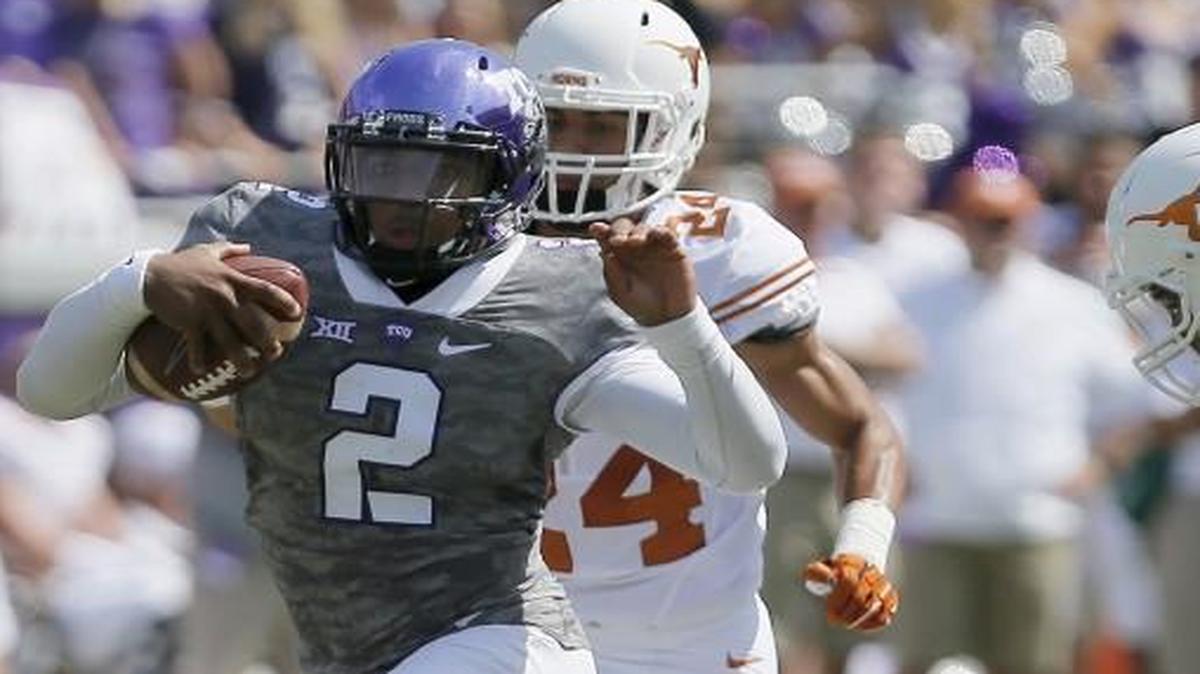 
TCU quarterback Trevone Boykin beats three Texas defenders. 

