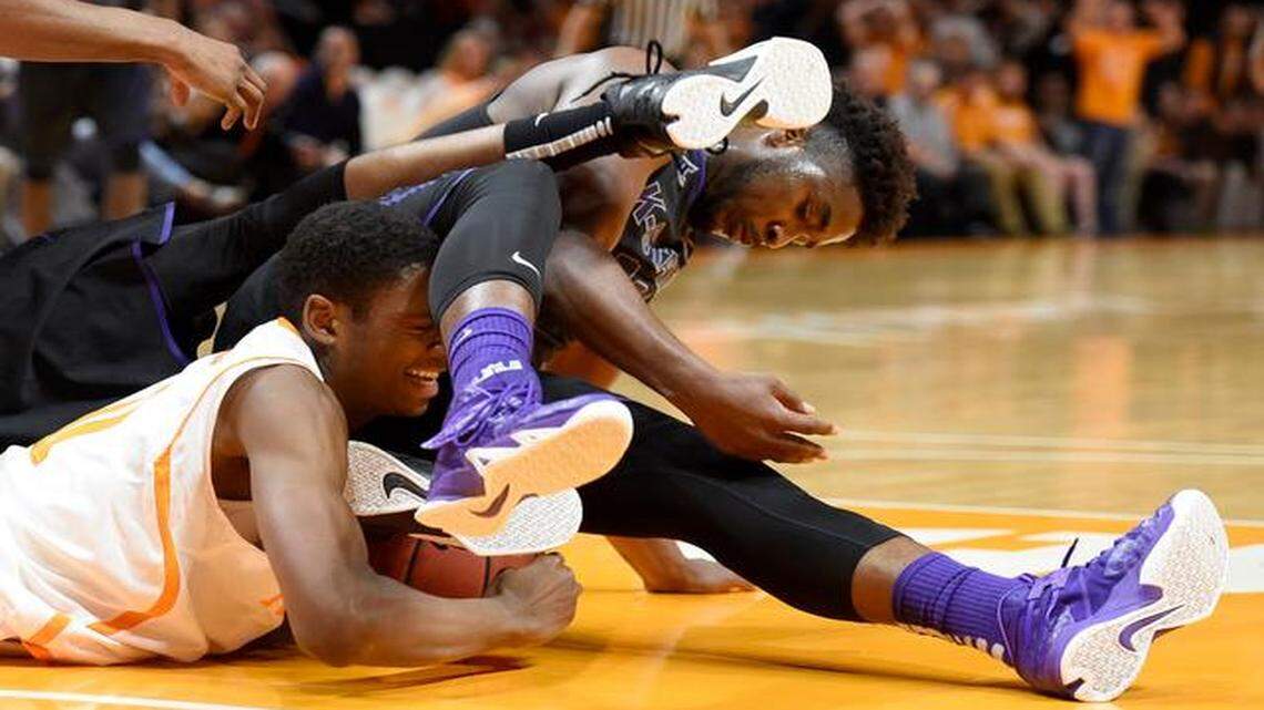 
Tennessee forward Tariq Owens (11) scrambled for the ball with Kansas State forward Nino Williams (11) on Saturday at Thompson-Boling Arena in Knoxville, Tenn. The Volunteers beat the Wildcats 65-64.
