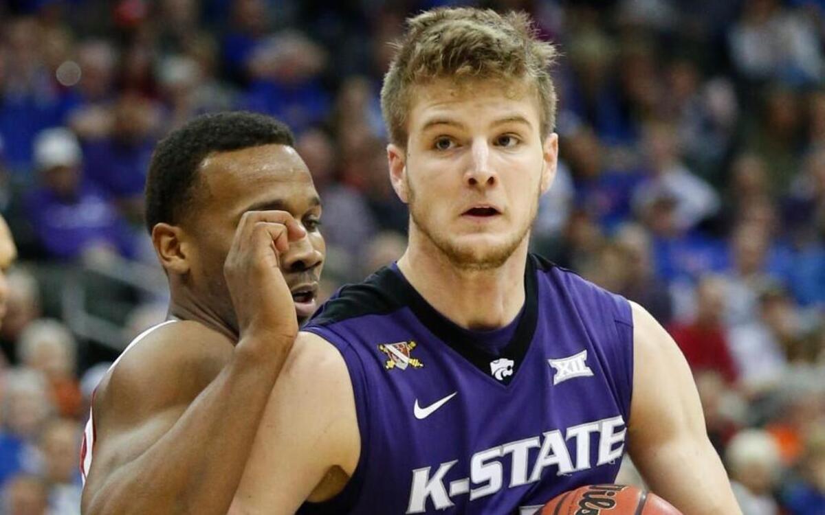 K-State forward Dean Wade tries to muscle his way past a Kansas defender. (March 10, 2016)