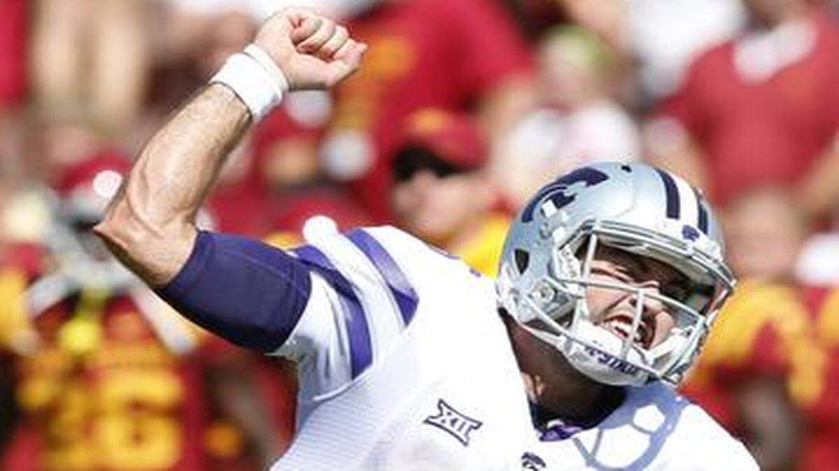 
K-State quarterback Jake Waters celebrated the Wildcats’ comeback Saturday at Iowa State.
