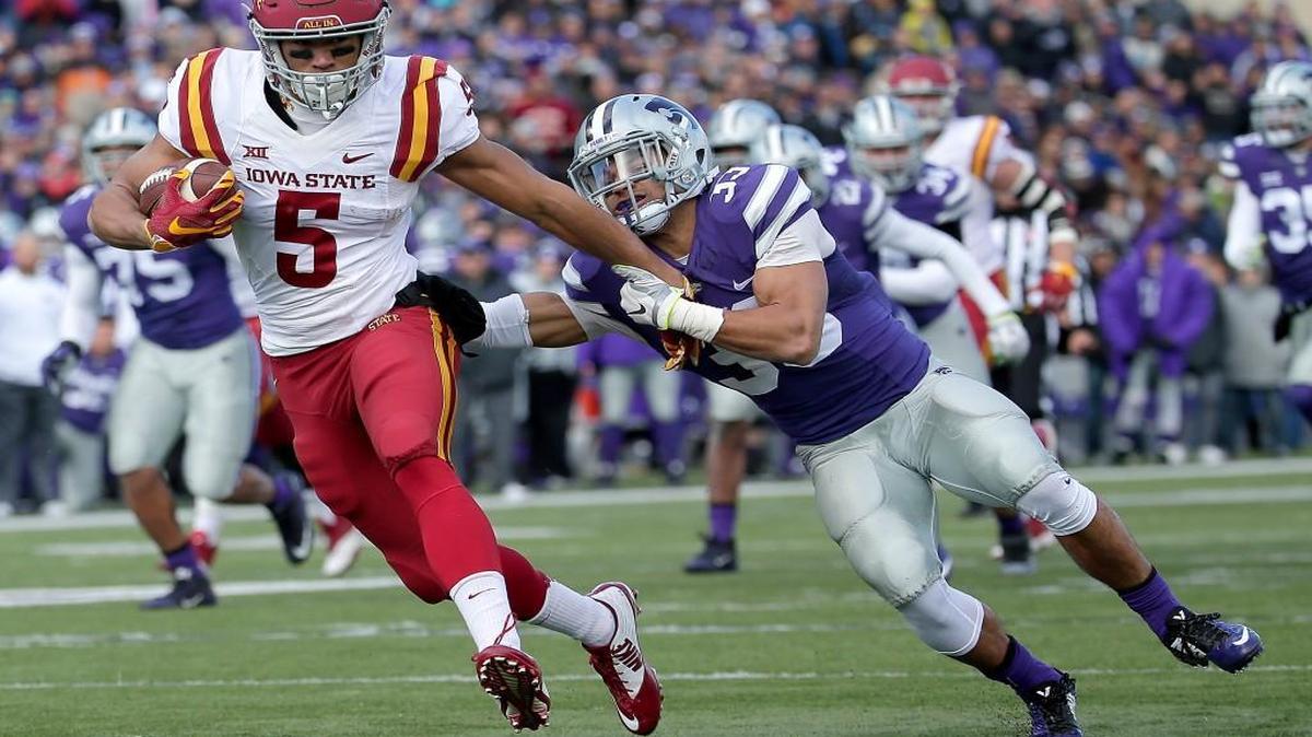 Iowa State wide receiver Allen Lazard (5) gets past Kansas State defensive back Morgan Burns (33) to score a touchdown during Saturday’s Big 12 football game in Manhattan, Kan.