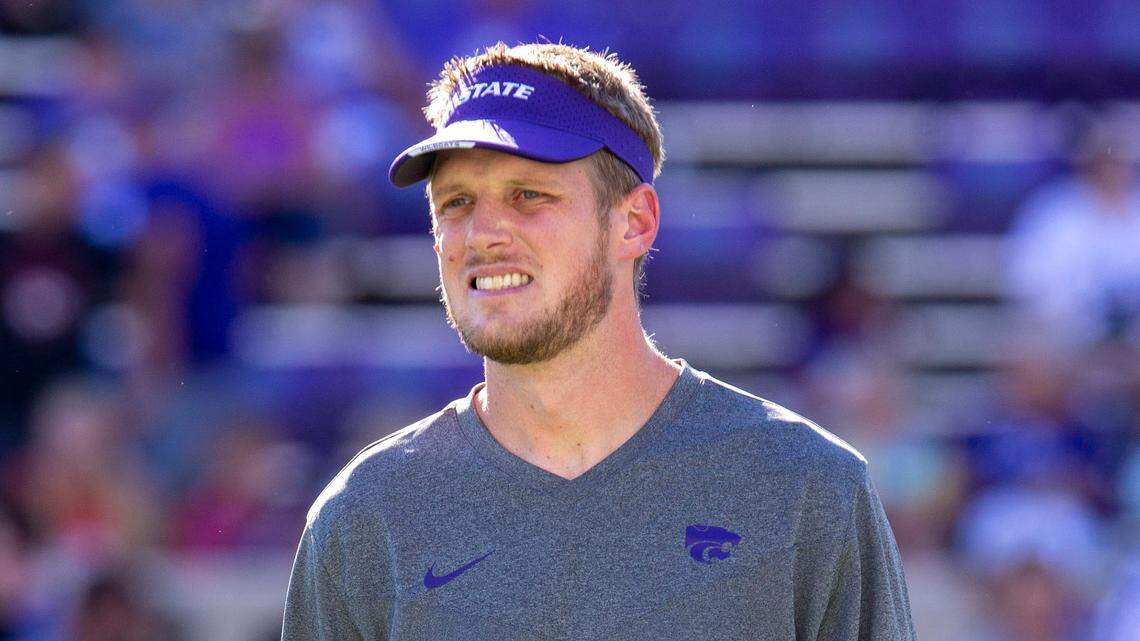 Kansas State Wildcats offensive coordinator Collin Klein watches the team warm up before the start of a game against the South Dakota Coyotes at Bill Snyder Family Football Stadium on Sept. 3, 2022.