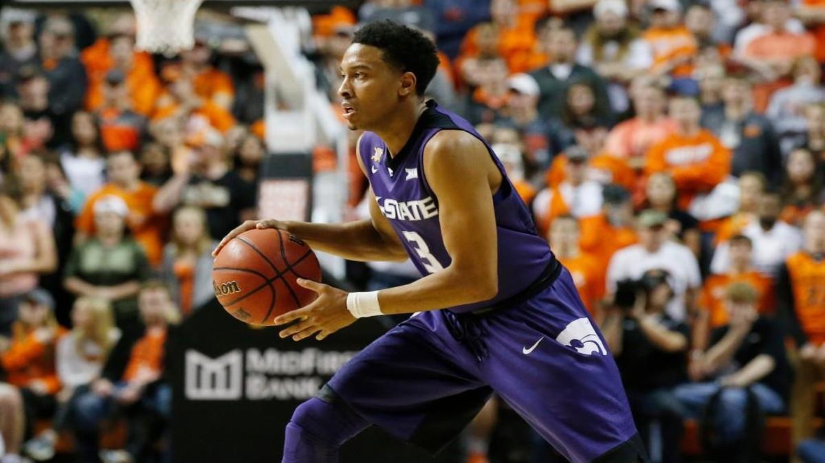 Kansas State guard Kamau Stokes looks to pass against Oklahoma State. (AP Photo/Sue Ogrocki)
