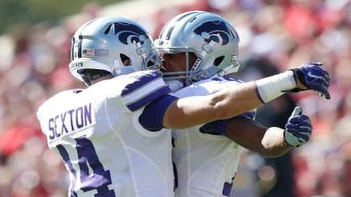 
K-State receivers Curry Sexton, left, and Tyler Lockett celebrate Lockett's big catch in the second half at Oklahoma in October.
