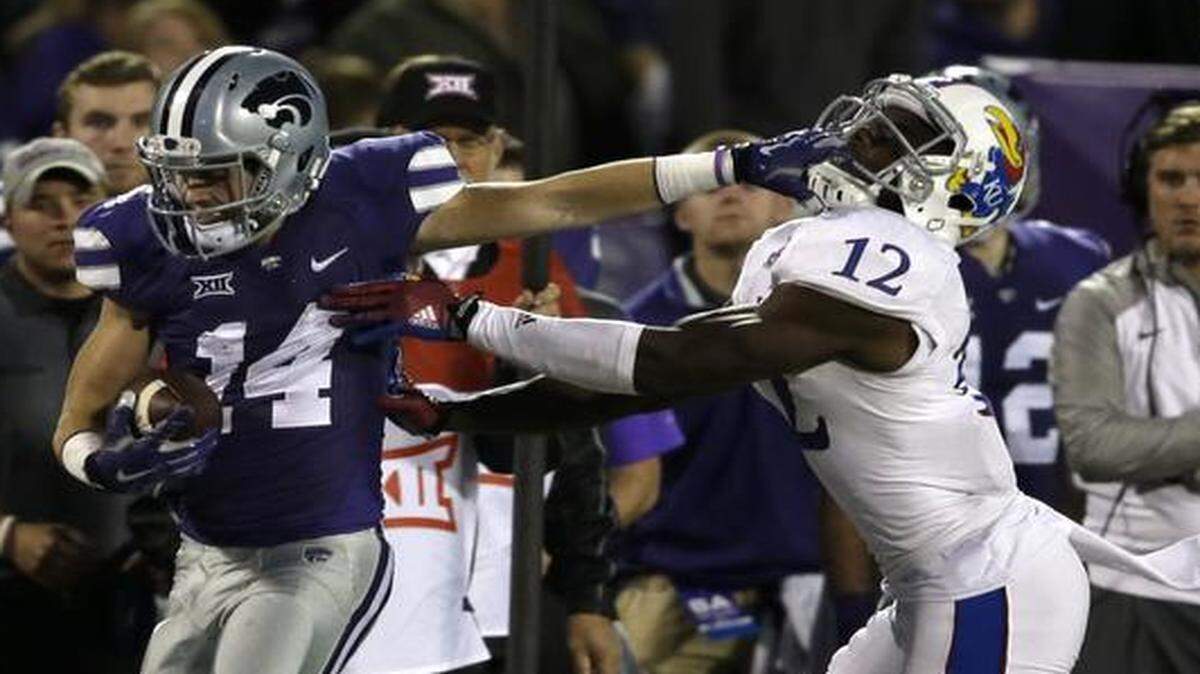 
Kansas State wide receiver Curry Sexton kept Kansas cornerback Dexter McDonald at arm’s length during last month’s game.
