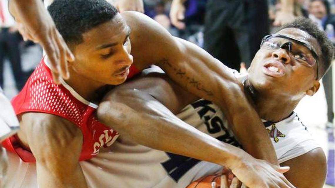 
Southern Utah guard Juwan Major (15) and K-State forward Stephen Hurt (41) battled for a loose ball Friday night in Manhattan.(November 14, 2014)
