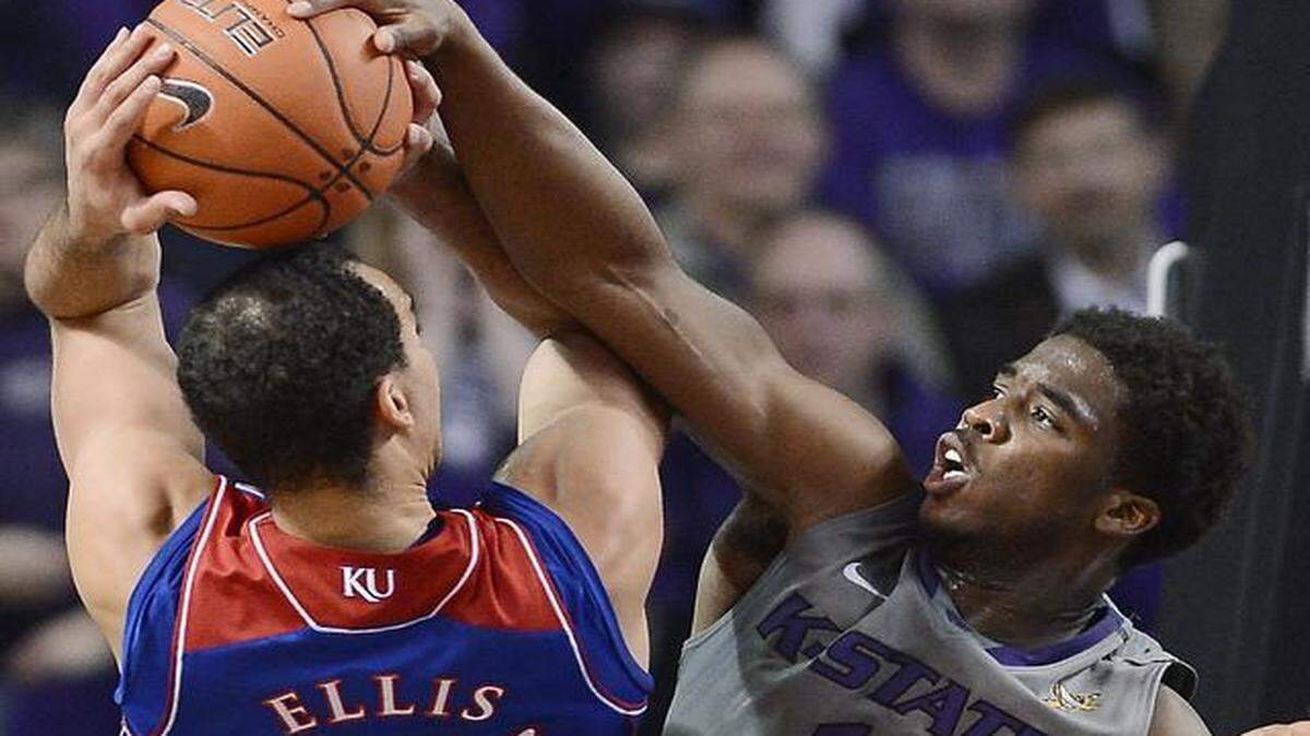 
Kansas and Perry Ellis are unlikely to see Kansas State’s Nino Williams (right) this Saturday.
