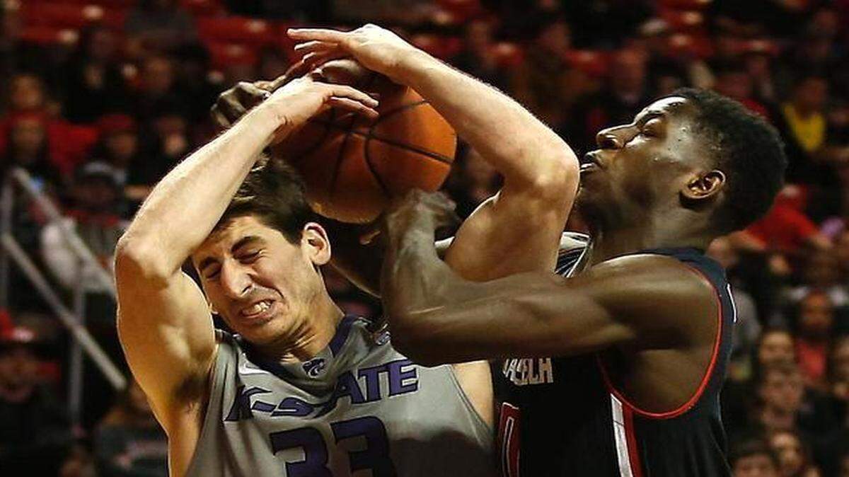 
With two players suspended, Kansas State put walk-on Brian Rohleder into the starting lineup Wednesday against Texas Tech. He battled Devaugntah Williams for a loose ball as the Red Raiders clobbered the Wildcats. 
