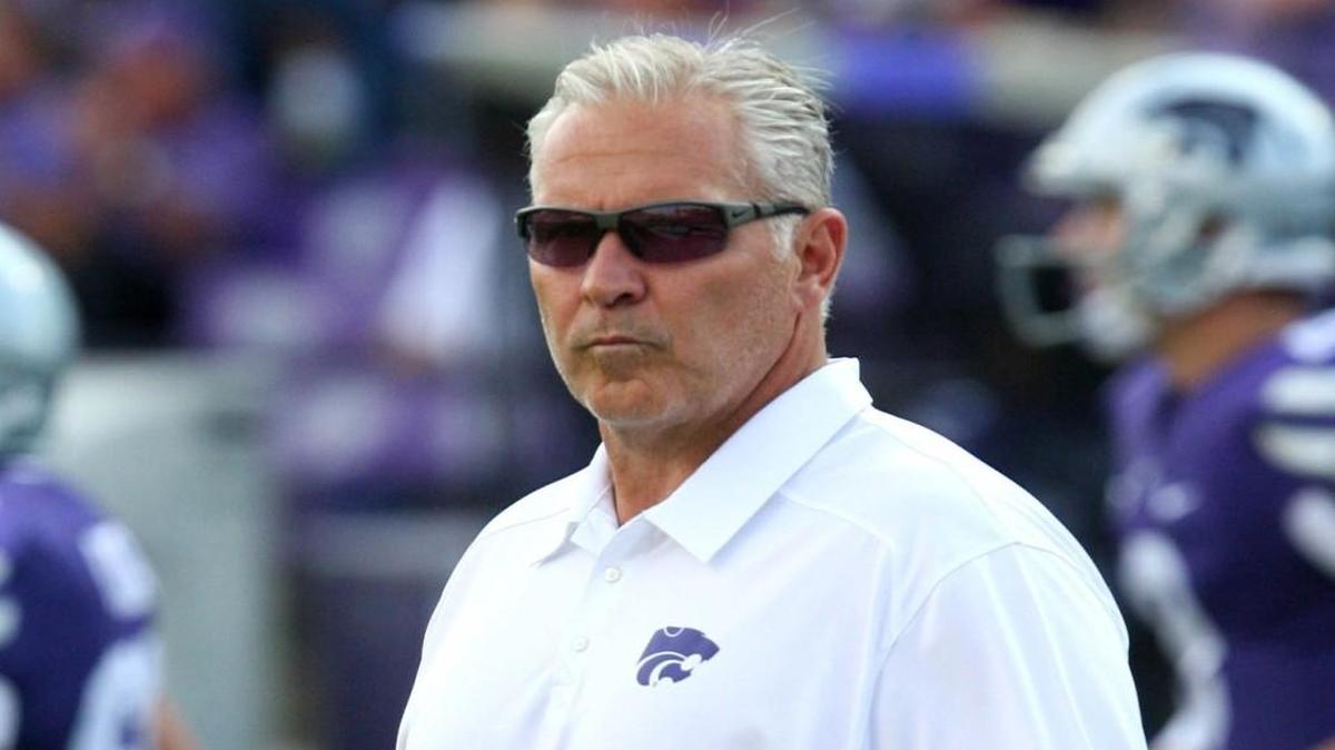 Kansas State offensive coordinator Dana Dimel watches as the Wildcats warm up before a game.