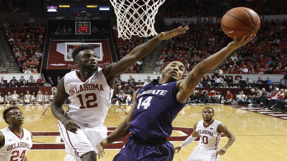 K-State guard Justin Edwards shoots in front of Oklahoma forward Khadeem Lattin on Jan. 9 in Norman, Okla.