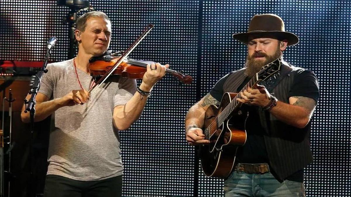 Jimmy De Martini, left, and Zac Brown of the Zac Brown Band perform in Phoenix last October.