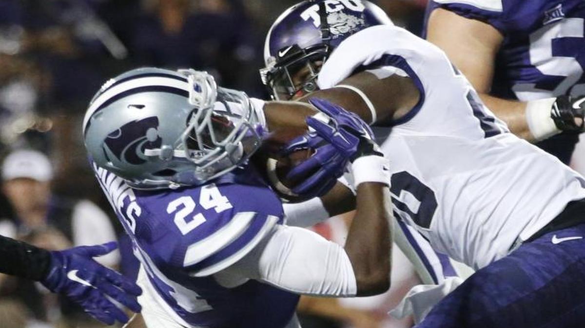 
K-State running back Charles Jones (left) dived across the goal line for a touchdown against TCU on Saturday.
