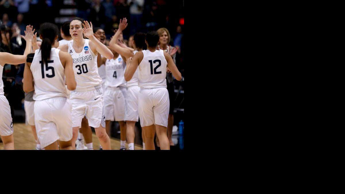 
Connecticut's Breanna Stewart (30) and teammates celebrated their 91-70 win over Dayton during a regional final game in the NCAA women's college basketball tournament on March 30 in Albany, N.Y.
