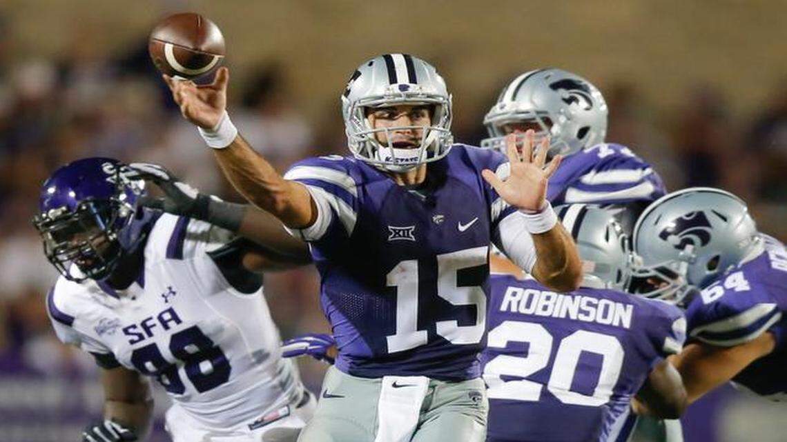 
Kansas State quarterback Jake Waters dumps off a pass against Stephen F. Austin.

