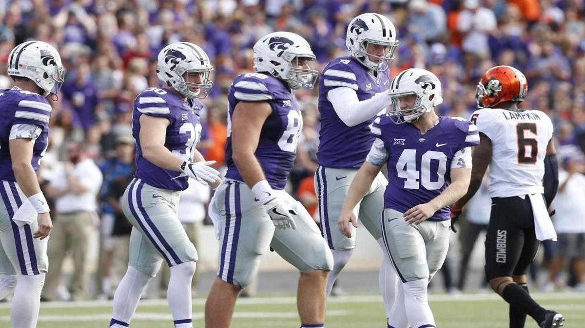 Kansas State’s Mitch Lochbihler, rear, congratulates kicker Ian Patterson (40) after making a field goal against Oklahoma State.