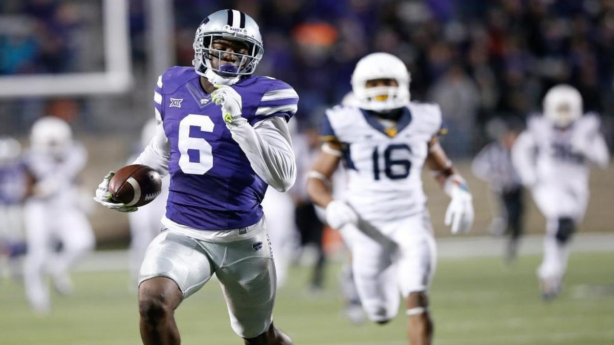 Kansas State wide receiver Deante Burton heads for a touchdown against West Virginia. (December 5, 2015)
