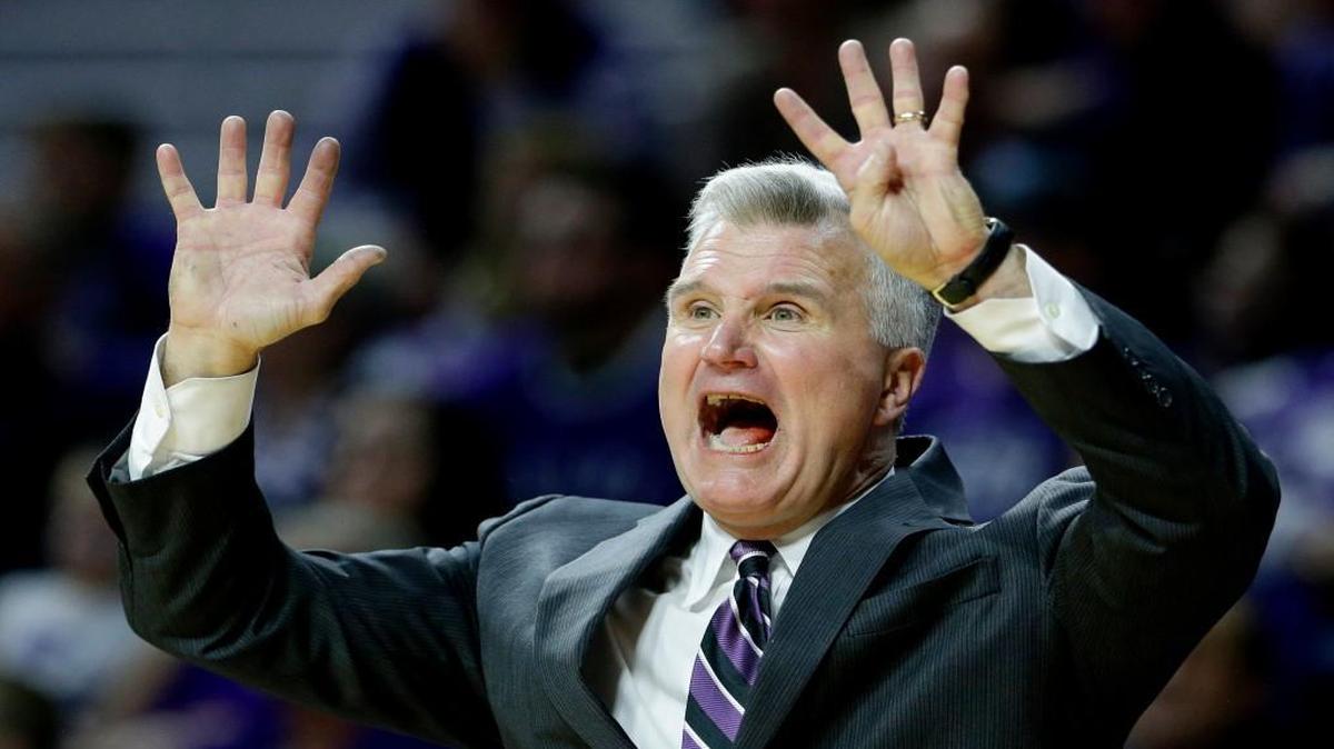 Kansas State coach Bruce Weber motions to his players during a game against West Virginia .