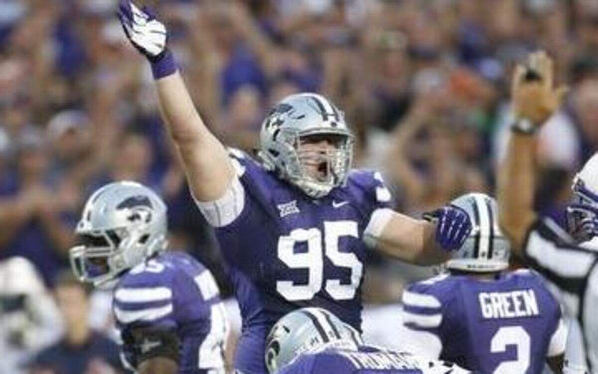 
K-State defensive lineman Travis Britz (95) signaled a K-State recovery against Auburn.
