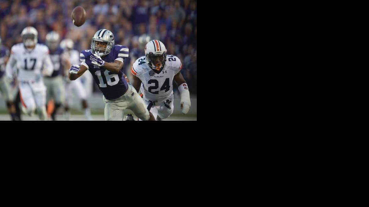 
Kansas State Wildcats wide receiver Tyler Lockett (16) dives, but comes up short on a reception as Auburn Tigers defensive back Derrick Moncrief (24) defends in the second quarter during the Kansas State University and Univeristy of Auburn football game at Bill Snyder Family Stadium on Thursday, September 18, 2014, in Manhattan, Kansas.
