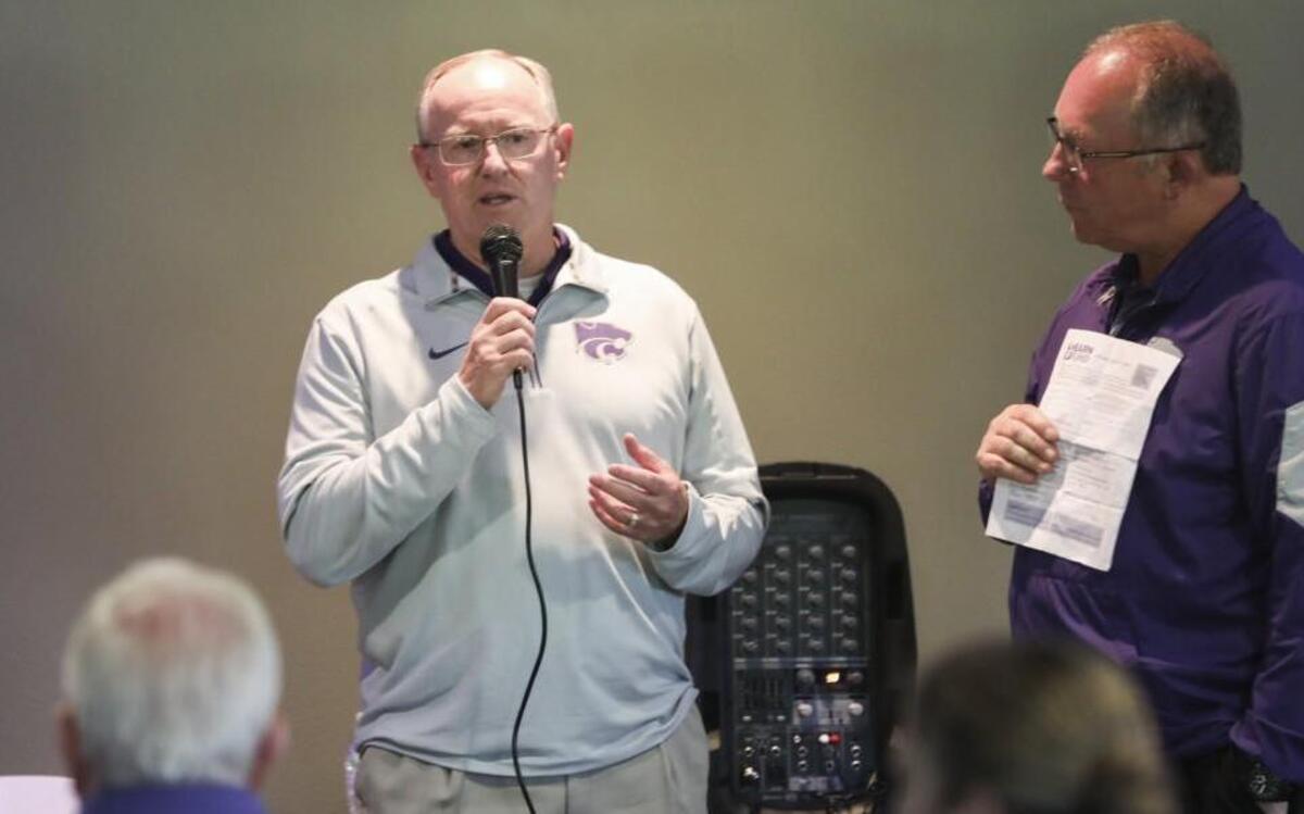 Kansas State's new athletic director Gene Taylor speaks to a crowd of supporters during the Catbackers stop Tuesday at Tanganyika Wildlife Park.
