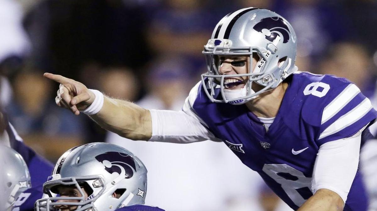 Kansas State quarterback Joe Hubener points out the defense to offensive lineman Dalton Risner against TCU last month.