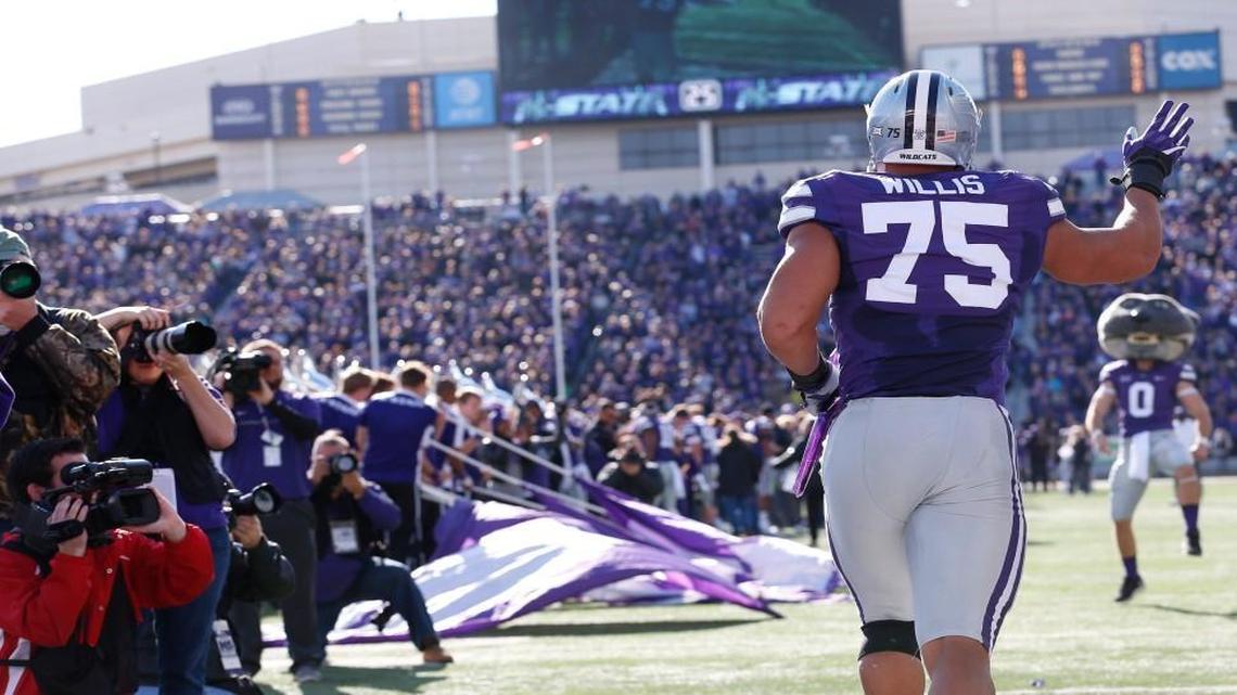 Senior K-State defensive end Jordan Willis takes the field before the final regular-season game against Kansas in Manhattan.