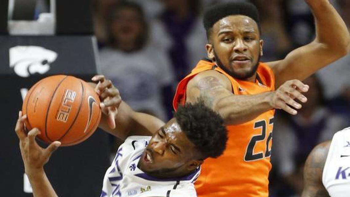 
Kansas State’s Nino Williams (left) fought for one of his seven rebounds on Saturday against Oklahoma State. Williams also scored in 20 points in the Wildcats’ 63-53 victory at Bramlage Coliseum in Manhattan, Kan.
