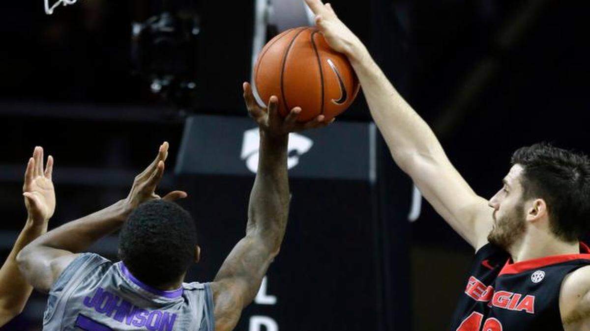 
Georgia forward Nemanja Djurisic (right) blocked a shot by Kansas State guard Nigel Johnson during the first half Wednesday
