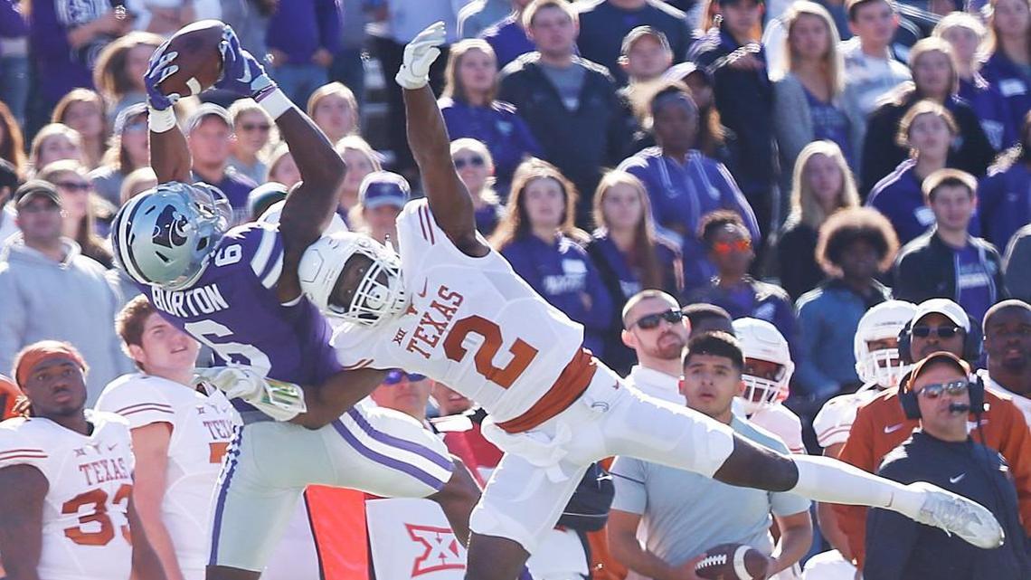 K-State receiver Deante Burton catches a pass over Texas cornerback Kris Boyd last month in Manhattan.