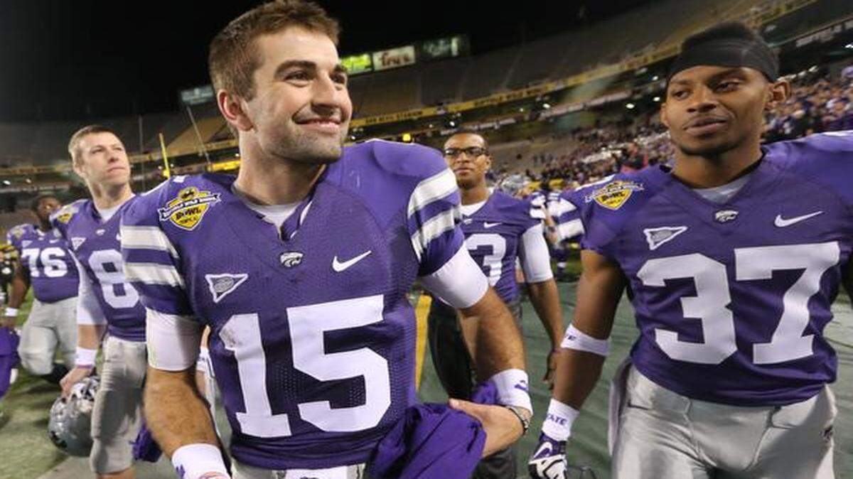 
A happy quarterback Jake Waters walks off the field after K-State's win in the Buffalo Wild Wings Bowl.

