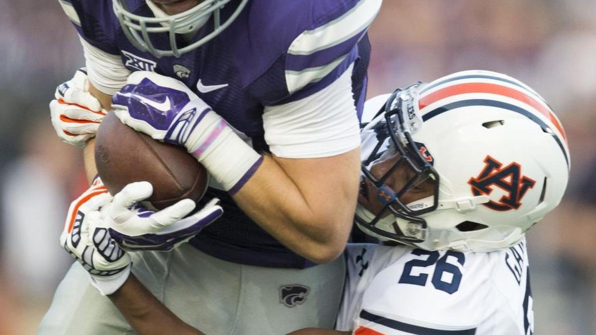 
Kansas State receiver/quarterback Kody Cook (top, seen in 2014) is questionable to play on Saturday, Oct. 10; he has an injured shoulder. Still, Cook exceeded all expectations last week when he moved from receiver to quarterback.


